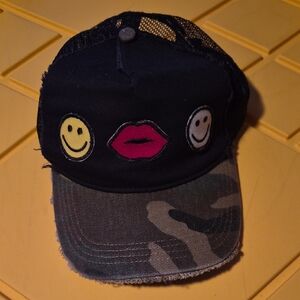 Black and Camouflage Cap with Smiley and Lips Patches laurrn moshi